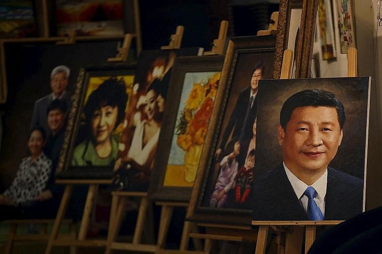 Chinese President Xi Jinping, whose portrait is seen here displayed in a Beijing art shop, is worried that the Communist Party is losing its relevance to the people. He has resuscitated dormant conferences and started new ones to show that the party 