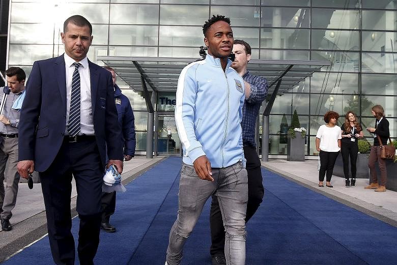 New Manchester City signing Raheem Sterling leaving the club's Etihad Stadium. At £49 million from Liverpool, he is their costliest purchase.