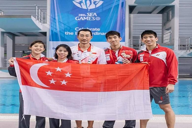 National diving coach Xu Jie with his charges (from left) Freida Lim, Myra Lee and twins Mark and Timothy Lee during last month's SEA Games in Singapore.