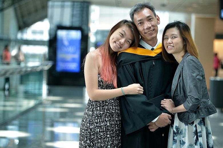 Senior military expert Eugene Low with his daughter, Daphne, 18, and his wife, Mrs Irene Low (far right), 44. Mr Low, who has 24 years of working experience with the SAF, said studying alongside peers 20 years his junior proved to be a challenge at f