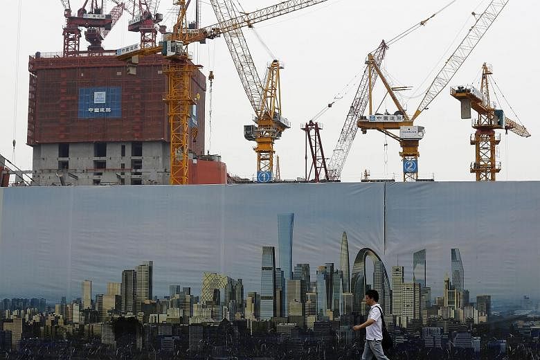 A construction site in Beijing. China's National Bureau of Statistics yesterday said the economy grew 7 per cent in the second quarter, better than economists' estimates of 6.8 per cent. Some analysts questioned the accuracy of the data, implying tha
