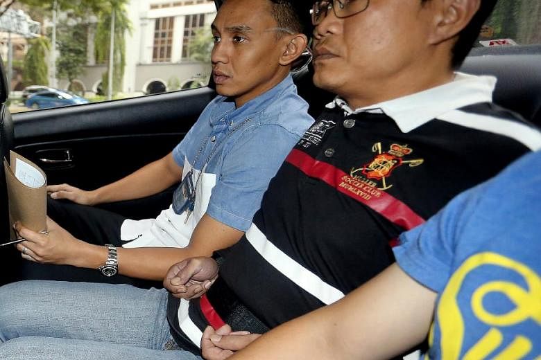 Ho Yueh Keong (right), who had been on the run for nine years, is charged with harbouring Tan Chor Jin, who had killed a nightclub owner in 2006. Ho allegedly helped Tan flee the law after the murder. 