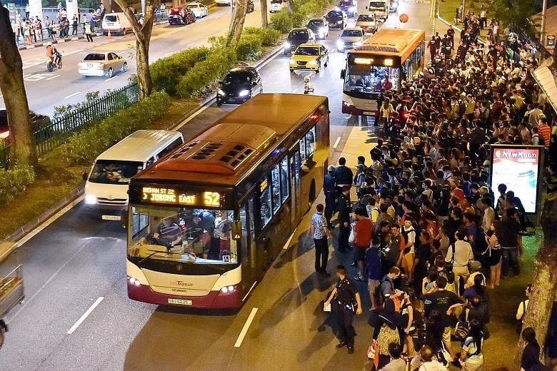 A big crowd waiting to board buses near Bishan MRT station on July 7. The North-South and East-West Lines were shut down for more than two hours during the evening rush hour, affecting more than 250,000 commuters. More buses were activated to ply the