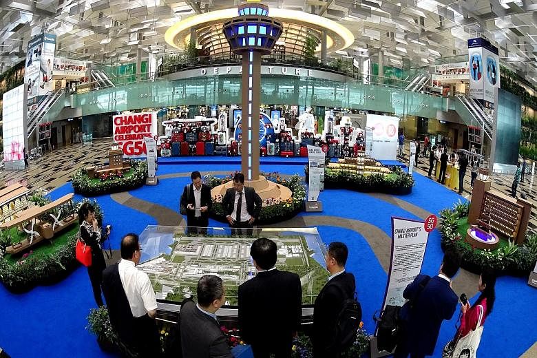 The exhibition area at Terminal 3 showcases Singapore's aviation history. The Changi Airport masterplan is on public display for the first time.