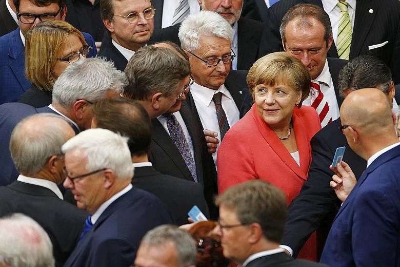 German Chancellor Angela Merkel at yesterday's voting session to decide whether to negotiate a third bailout for Greece. Germany is the euro zone country that has contributed the most to Greece's previous bailouts.