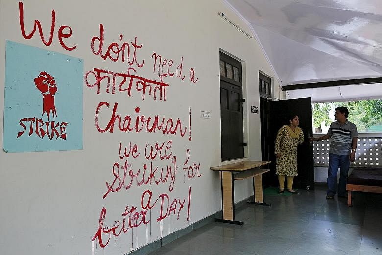 Graffiti in an office at the Film and Television Institute of India reflects the sentiments of the students. Some people fear that the choice of BJP member Gajendra Chauhan as chairman of the institute signals a push by Prime Minister Narendra Modi's
