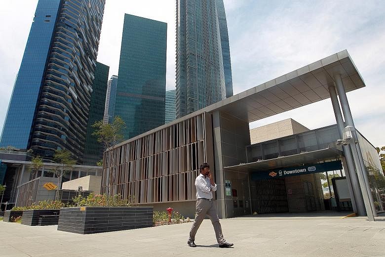 The Cushman & Wakefield report says that there have been recent moves by banks and tech companies to relocate from core CBD areas such as the Marina Bay Financial Centre (above, background) to business parks "where rents are at least 30 per cent lowe