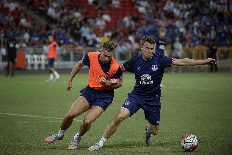 Everton's Gerard Deulofeu (left) and Seamus Coleman training at the National Stadium on Tuesday. Phil Jagielka said the Toffees, who face Arsenal in the Barclays Asia Trophy final today, "have more options now".