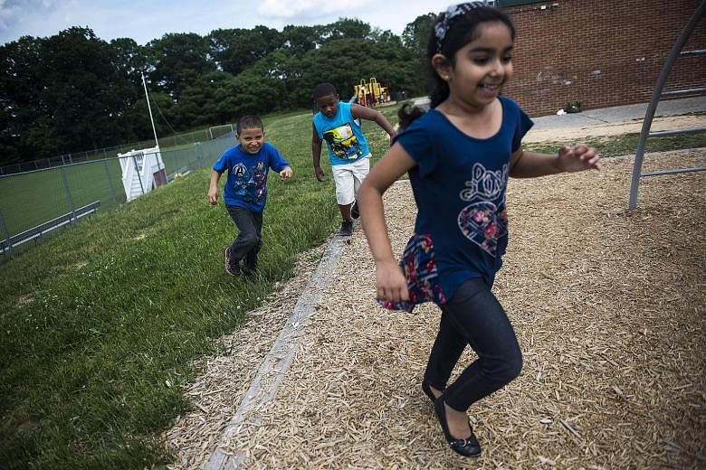 Kindergartners during recess at a Baltimore district school, where the new curriculum for five-year-olds will integrate time for play. After focusing on raising test scores in maths and reading, more school districts in the US are embracing play as a