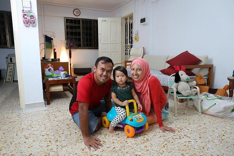 Mr Muhammad A'srie Che Ali, his wife Jaclyn and their daughter Maryam, at the three-room flat in Dover that they have been renting.
