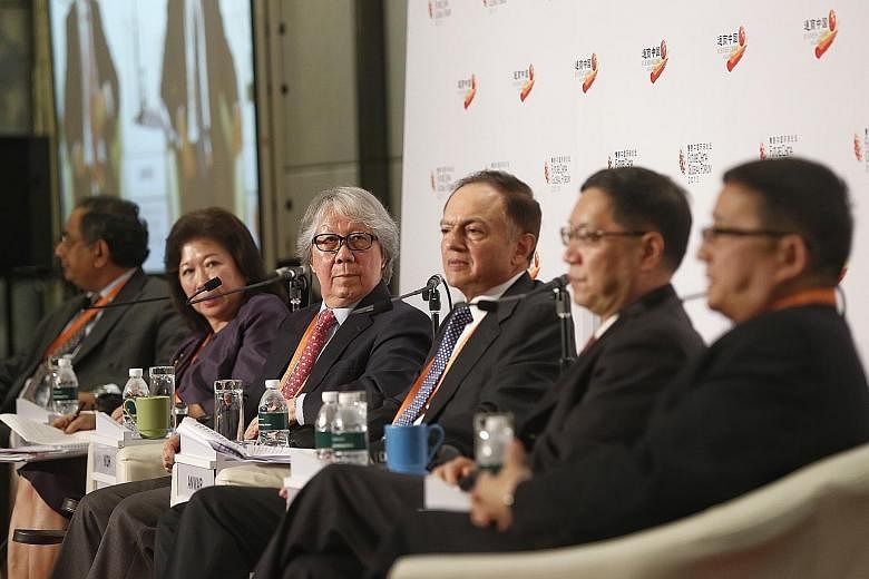 Straits Times associate editor Ravi Velloor (left) with panellists (from left) Professor Mari Pangestu, Ambassador-at-Large Tommy Koh, Mr Yaseen Anwar, Professor Shen Dingli and Mr Li Cheng, during yesterday's session on China as a challenger and a p