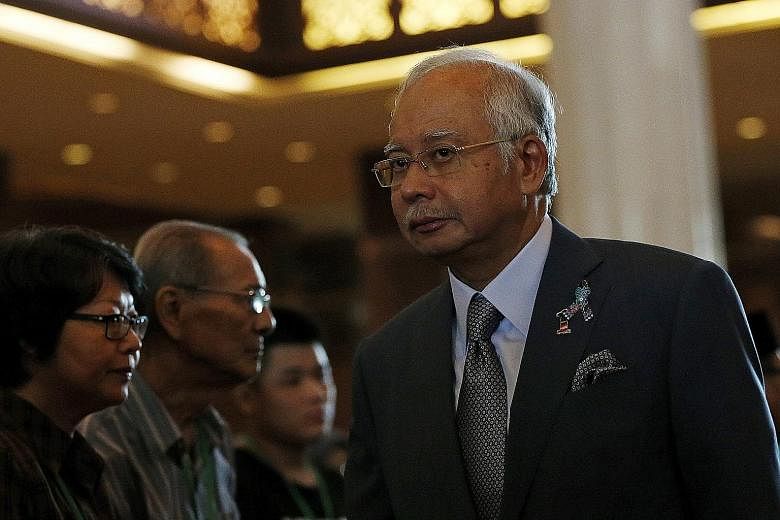 It is business as usual for Prime Minister Najib Razak, even as others around him are busy fighting fires.
