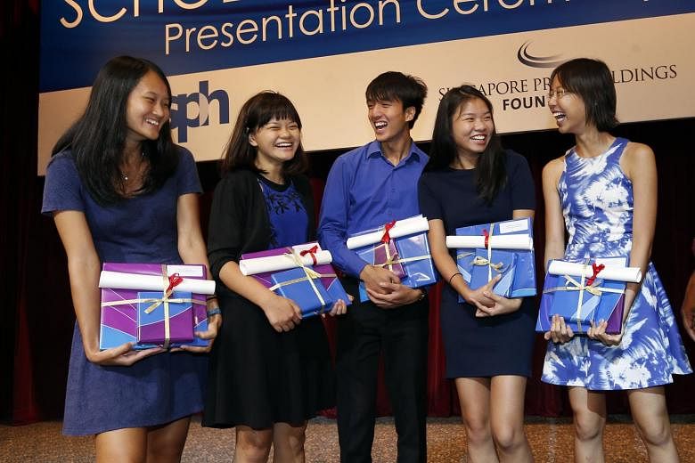 The SPH journalism scholarship recipients are (from left) Ms Jean Lau, 20; Ms Prisca Ang, 19; Mr Yap Jun Weng, 21; Ms Charmaine Ng, 22; and Ms Clara Chong, 19. Ms Chong, who is a sports intern reporter with The Straits Times, said she is looking forward t