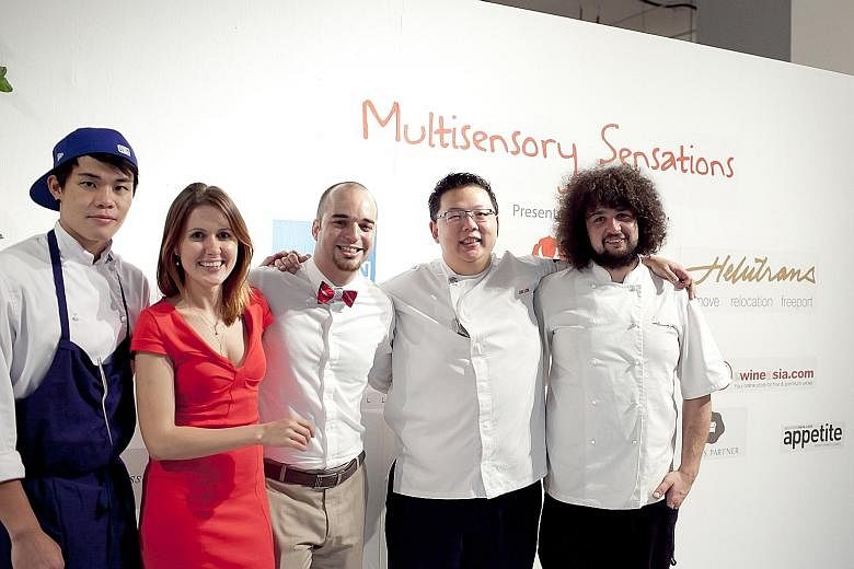 Ms Maria Kuvshinova with her Clubvivre co-founder Andries de Vos (in bow tie) and some of the chefs of their start-up. She says companies with global aspirations that want to start out in Asia should look to Singapore first.