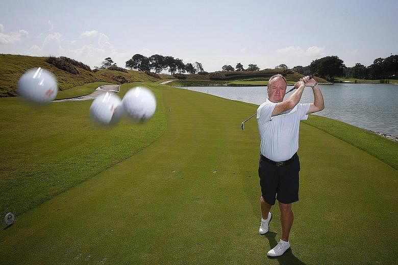 Allan Muir with his three hole-in-one balls at the Laguna National Golf and Country Club, where he has hit two of his three aces since June 4.