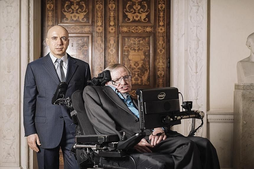 Entrepreneur Yuri Milner (left, with Prof Hawking) believes other civilisations can teach humans how to handle challenges.