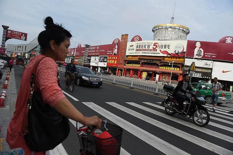 The main shopping street in Hunchun, in China's north-eastern Jilin province. The nondescript town is at the heart of Beijing's plans to revitalise its north-eastern rust belt.