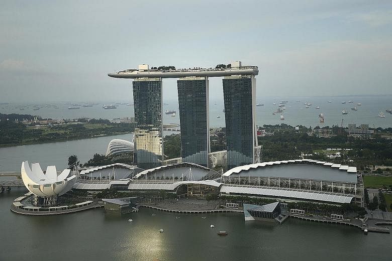 Marina Bay Sands suffered a steep 11.4 per cent decline in revenues to $974 million. Its revenue per available room and average daily rate were undermined by a strengthening greenback against the Singdollar amid expectations the US central bank will 