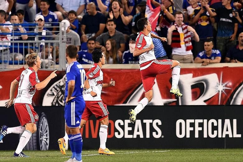 New York Red Bulls midfielder Sean Davis (right) celebrating after scoring one of his two goals in the 4-2 win over Chelsea.