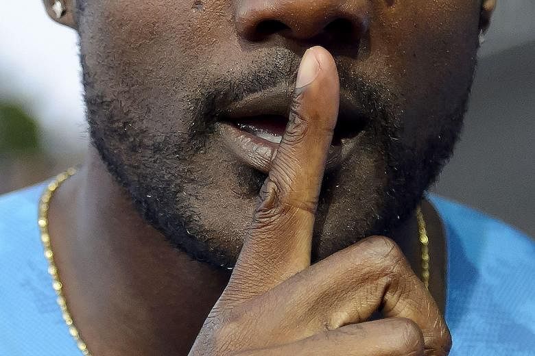 American athlete Justin Gatlin making his point to critics after winning the 100m at the Diamond League meeting on July 9 in Lausanne. At age 33, he is clocking the fastest times of his career.