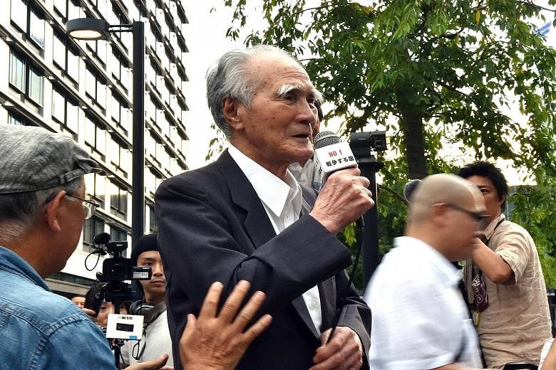 Former Japanese premier Tomiichi Murayama speaking at yesterday's anti-government rally in Tokyo. While in power in 1995, Mr Murayama made a landmark apology for the wartime damage caused by Japan.