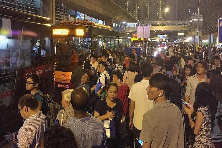 Commuters jostling for buses outside an MRT station after a train disruption. In the latest National Values Assessment survey, many respondents also said they felt society was materialistic and self-centred.