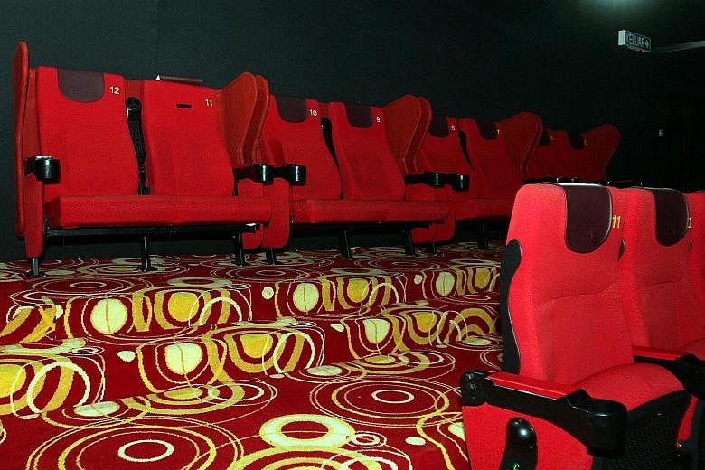 The ban on unmarried Muslim couples buying tickets for couple seats at the Lotus Five Star cinema (above) in Seri Iskandar in Perak has been in force since the cinema opened its doors two years ago, but photos that have since been circulated online h