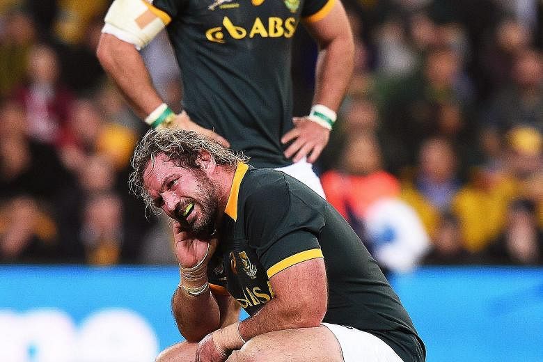 South Africa's Jannie Du Plessis (front) shows the anguish of the dramatic last-gasp loss to the Wallabies in Brisbane on July 18. PHOTO: EPA