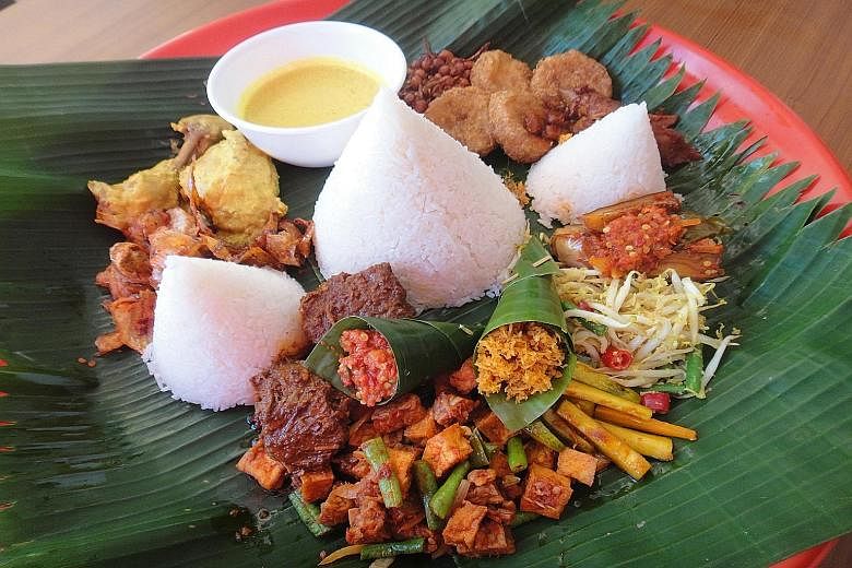Nasi ambeng from Makmur Restaurant (left) and Hajjah Mariam Cafe (below left).