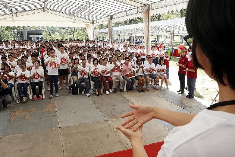 About 450 people gathered at Bishan-Ang Mo Kio Park yesterday to recite the national pledge but passers-by would have found it hard to catch the words. For the recital was done in sign language, by hearing-impaired participants, workers and volunteer