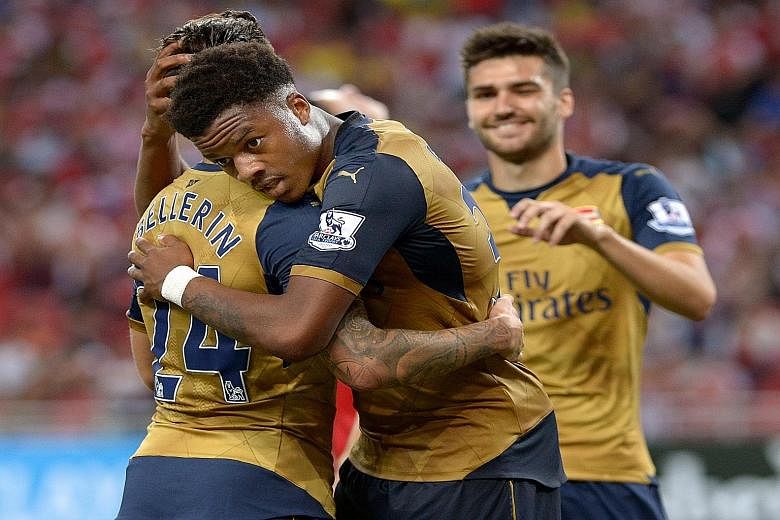 Chuba Akpom (centre), who bagged a hat-trick for Arsenal against a Singapore Selection at the recent Barclays Asia Trophy, is only 19 years old. He could turn out to be another gem under Arsene Wenger's polishing.