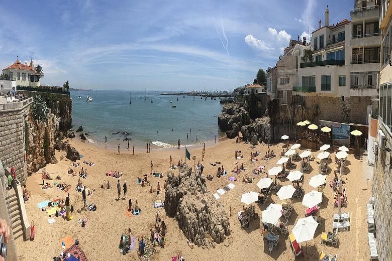 Sunbathers at the Praia da Rainha (above), one of many beaches in the seaside town of Cascais; the Sao Bento train station (left) in Porto; and the River Douro (right) in Porto. The Roman temple of Evora (left) and the Church of the Most Holy Trinity