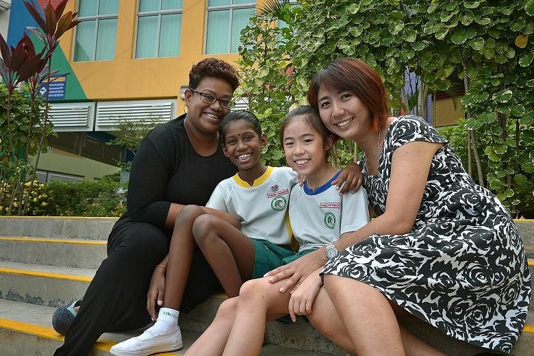MADAM RACHEL KOW, with daughter Janelle. Her views are shared by Madam Nahrahyeenee Tamil Selvan, who is pleased that the school is helping her child, Tharine, develop self-confidence