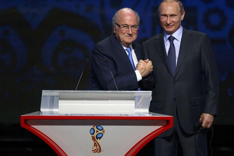 The 2018 World Cup qualifying draw, attended by Fifa president Sepp Blatter and Russian President Vladimir Putin (right), was beamed live to 170 countries. Mr Putin has promised to host a tournament that will provide fans and players with a grand sporting