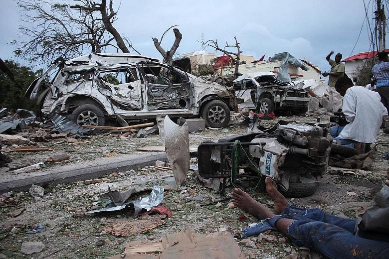 Several vehicles were destroyed around Jazeera Palace hotel in Somalian capital Mogadishu after Sunday's suicide bombing.