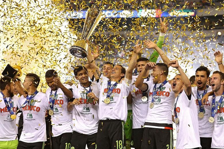 Andres Guardado of Mexico (holding trophy) and team-mates celebrate after defeating Jamaica 3-1 in the Concacaf Gold Cup final in Philadelphia on Sunday. It was Mexico's seventh title while host nation United States finished fourth.