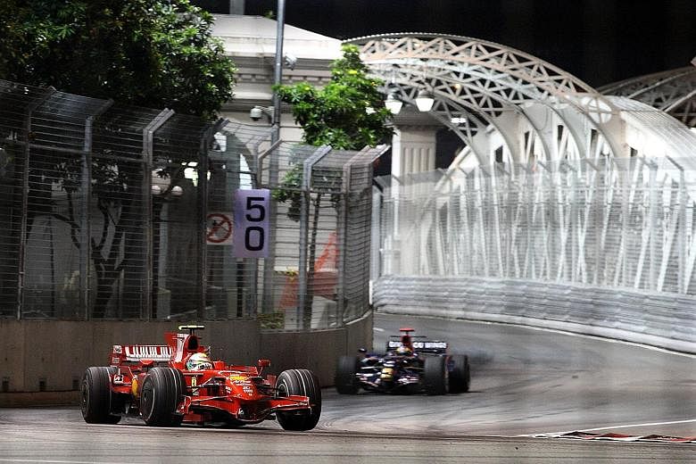 A Ferrari car making a turn after the Anderson Bridge at the Singapore Grand Prix. The Turn 13 hairpin turn after the bridge will be widened by one metre for this year's GP in September.
