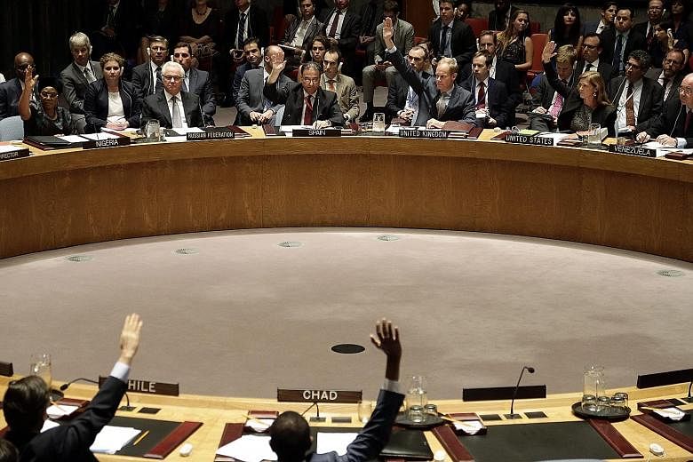 UN Security Council members voting yesterday on a resolution that sought to set up a tribunal to try those responsible for shooting down Flight MH17 over Ukraine last year. Australia, Belgium, Malaysia, the Netherlands and Ukraine, which drafted the 