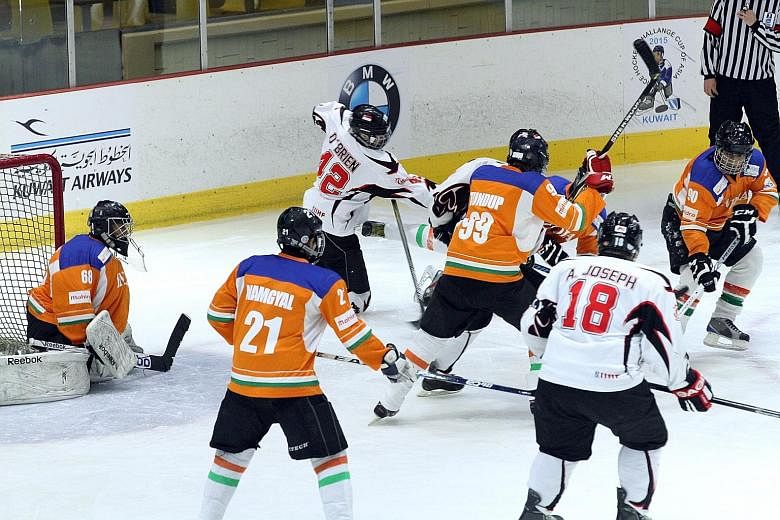 Despite the challenges of training and funding, the Singapore men's ice hockey team (in white) managed a 2nd-place finish in the International Ice Hockey Federation Challenge Cup of Asia in Kuwait in March.