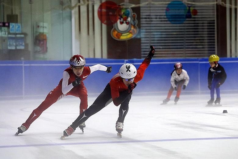 Short-track speed skaters Lucas Ng (in black suit bottoms) and Matthew Mak in action. The pair hope to compete at the 2017 SEA Games.