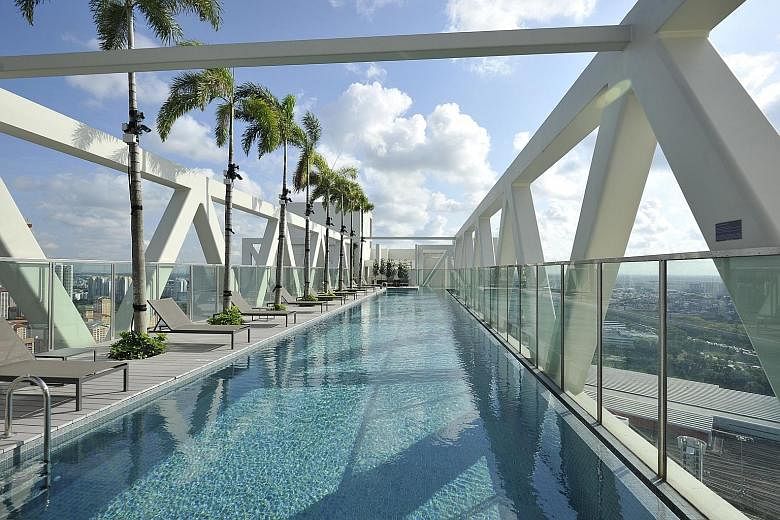 The 38th floor of Sky Habitat has a pool (left) that offers a panoramic view of central Singapore.
