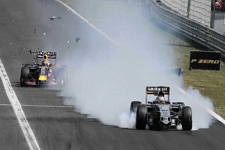 Force India's German driver Nico Huelkenberg (right) struggling to control his car before crashing into the barriers after his front wing broke off along the fastest straight at the Hungaroring. The drivers honoured Jules Bianchi in the perfect way, 