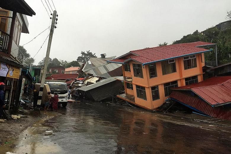 Homes destroyed by a landslide caused by heavy rain in Harkhar in Myanmar's Chin state.