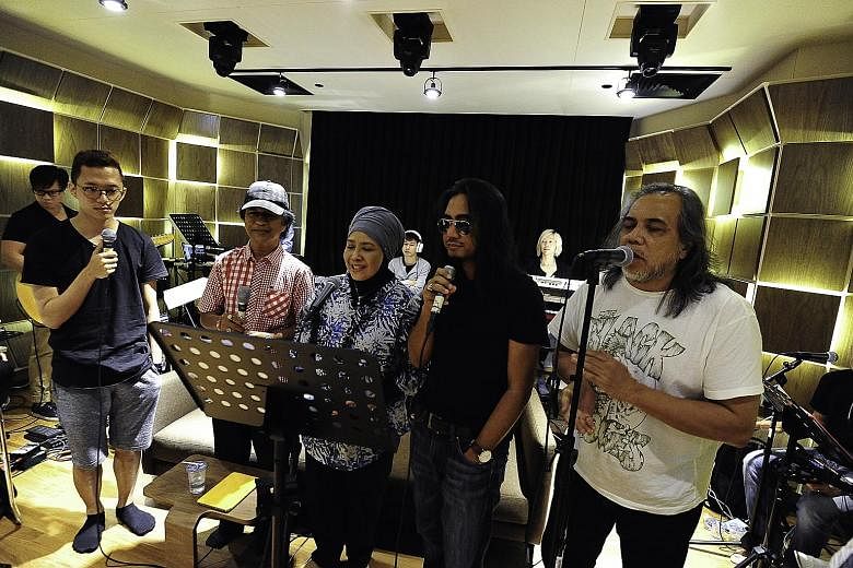 (From far left) Sezairi, Jeffrydin, Rahimah Rahim, Art Fazil and Ramli Sarip in rehearsal for the Sing50 Concert. Stefanie Sun will sing with a full orchestra for the first time at Sing50.