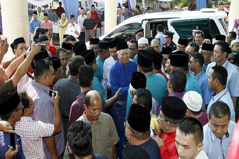 Umno president Najib Razak arriving to open the Seremban division's annual general assembly. In a speech at the meeting, Mr Najib warned he valued loyalty over intelligence and stated that a "ship can only have one captain".