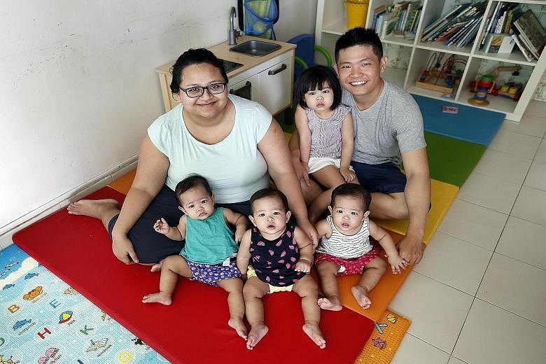 Madam Ermita Soenarto and her husband, Mr Loo Ming Da, with their 10-month-old triplets (from left) Lucia, Liora and Lysbeth, and three-year-old daughter Livia.