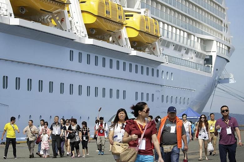 Chinese tourists at the port of Hakata in Fukuoka, after arriving in Japan on the Quantum of the Seas cruise ship. Four million Chinese tourists - a two-thirds increase from last year - are expected to head to Japan this year, and ships like the SkyS