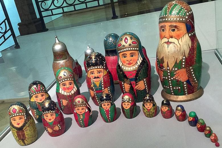 Traditional matryoshka dolls displayed at an exhibition in Moscow. (above and left). For tourists, they are a must-buy souvenir.