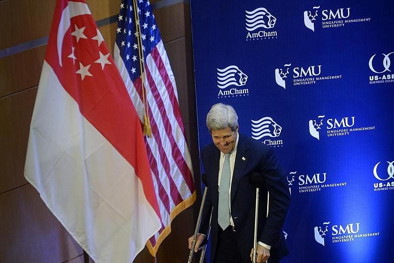 US Secretary of State John Kerry, on crutches after a cycling accident in Switzerland, at the Singapore Management University event yesterday. He said senior economic officials and chief innovation and technology officers from leading companies will 