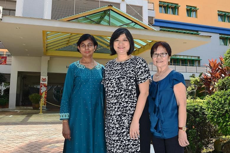 Yio Chu Kang Secondary's principal Janice Heng (centre) with maths teacher Annie Matthews (left), who joined the school in 1984, and contract teacher Mak Pak Lum, who joined in 1975.